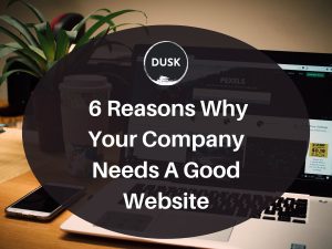 1 Front image of a blog titled "6 Reasons Why Your Company Needs a Good Website " with the website screen on a laptop placed on top of a wooden desk as the background and the title displayed in corporate typography