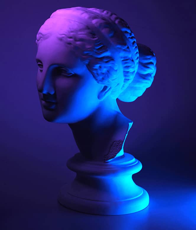 Mars Surface 1 neon coloured female face gypsum statue on a dark blue background