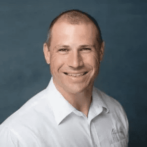 1 Marin of The Trusted Home Buyer in white shirt and black fog background