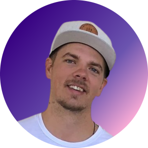 8 Brendan Anderson in a light blue t-shirt smiling on a blue and purple ombre circle frame on a transparent background