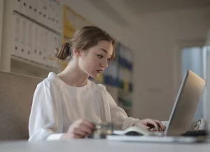 Photo of a girl browsing remote jobs that doesn't require experience